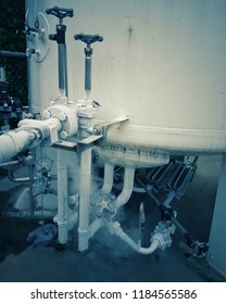 Filling Tanker Truck With Liquid Nitrogen. Cold Metal Pipe Smoking From Transferring Liquid Nitrogen