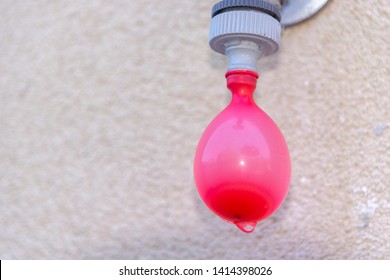 Filling Water Ballon On Water Faucet - Outdoor Play