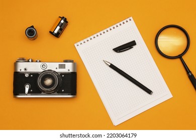 A Film Camera On A Photojournalist's Desk. Shallow Depth Of Field