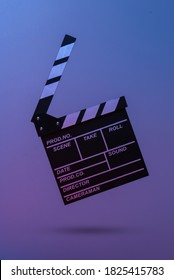 Film Clapper Board In Blue Red Neon Light. Cinema Industry, Entertainment. Minimalism, Concept Art. 3d Photo