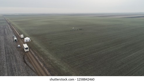 Film Crew Setting Up Scene In Crop Field Winter 