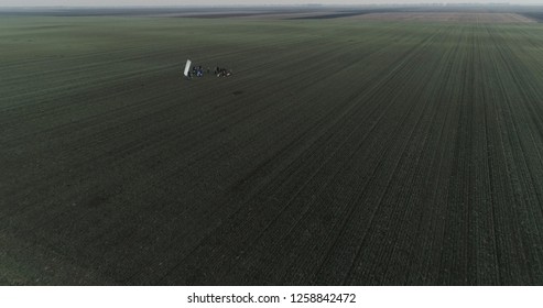 Film Crew Setting Up Scene In Crop Field Winter 03