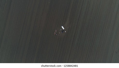 Film Crew Setting Up Scene In Crop Field Winter 
