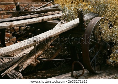 Film image Old Derelict Wooden Wagon beside an old brick wall