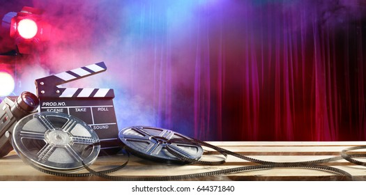 Film movie Background - Clapperboard And Film Reels In Theater
				