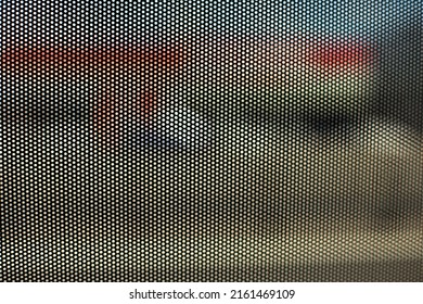 Film On Glass Of Mesh Texture. Advertising Film From Inside Interior Of Bus. Fine Grid And Blurry Background.