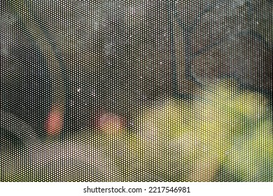 Film On Glass Of Mesh Texture. Advertising Film From Inside Interior Of Bus. Fine Grid And Blurry Background.