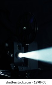 Film Projector. Cinema Projector Light Beam - Ray Of Light Film Reel On Retro Film Projector.