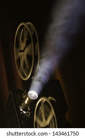 Film Projector In Smokey Room.