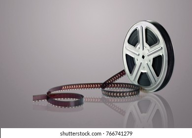 Film Reel on Reflective Surface - Powered by Shutterstock