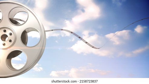 Film rolling out of a film reel against digitally generated background - Powered by Shutterstock