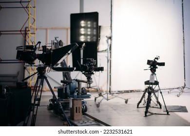 Film set, monitors and modern shooting equipment. Film crew, lighting devices, monitors, playbacks - filming equipment and a team of specialists in filming movies, advertising and TV series - Shutterstock ID 2232531621