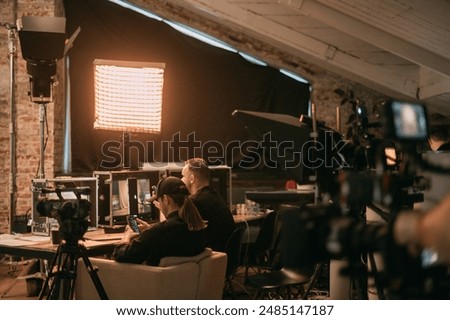 Film set, monitors and modern shooting equipment. Film crew, lighting devices, monitors, playbacks - filming equipment and a team of specialists in filming movies, advertising and TV series