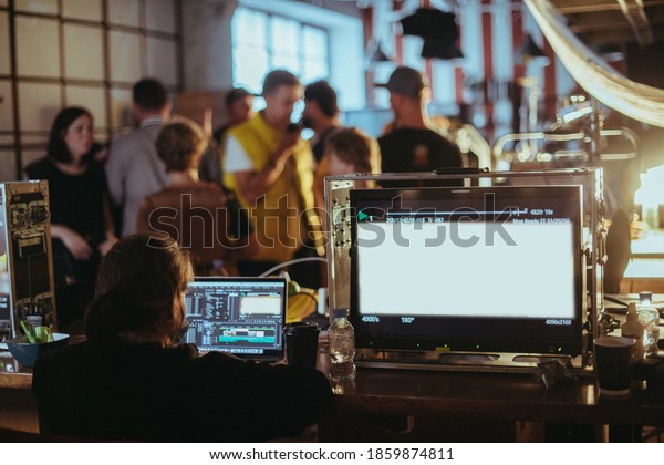 Film set, monitors and modern shooting equipment.\
Film crew, lighting devices, monitors, playbacks - filming\
equipment and a team of specialists in filming movies, advertising\
and TV series