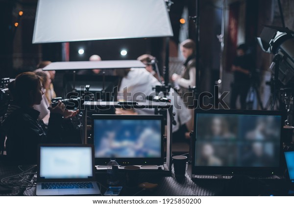 Film set, monitors and modern shooting equipment.\
Film crew, lighting devices, monitors, playbacks - filming\
equipment and a team of specialists in filming movies, advertising\
and TV series