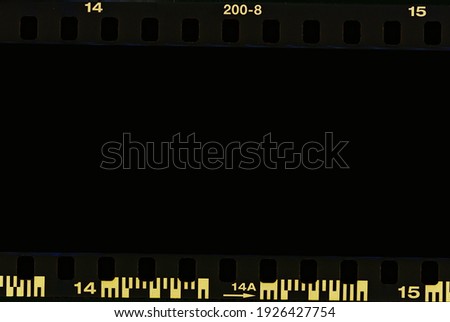 Film strip, blank photo frames, free space for your photo, real high-res 35mm film strip scan with signs of usage on bezel. blank old grunge film strip frame background. retro film border with number.