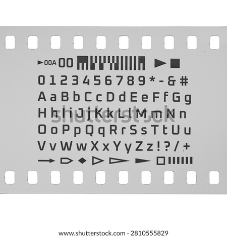 Film strip displaying an array of typographic characters, numbers, and symbols for data representation.