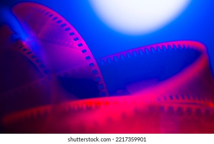 film strip and film roll on blue background isolated for desktop wallpaper banner.film production media festivals concept - Shutterstock ID 2217359901