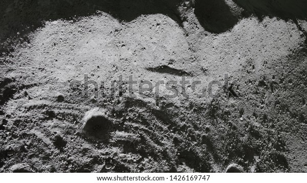 Film studio set with miniature model of the\
craters on the Moon surface, shoot under small led lights with a\
wide angle lens for the short movie, honoring 50 year anniversary\
of the Apollo 11 program.