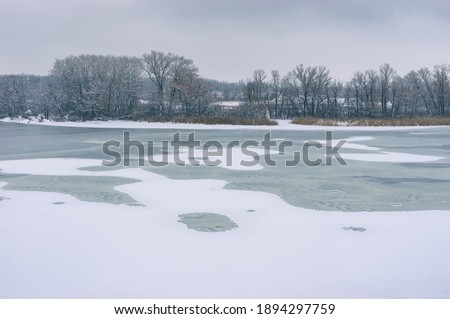 Film stylized landscape with of Dnepr river at January near Dnipror city, Ukraine