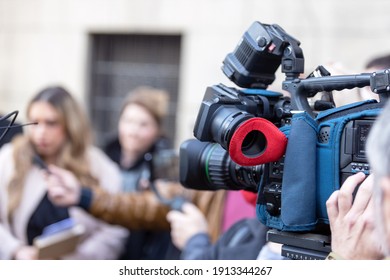 Filming Media Event Or News Conference With A Video Camera. Public Relations - PR Concept.