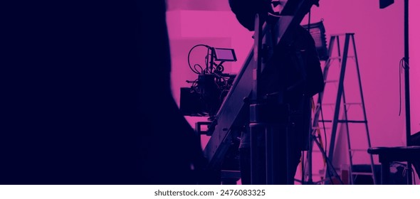 Filmmaker crew team with professional cinema equipment and video camera on the set. Film director and crew making commercial content advertising in studio. Technique of modern filming and advertising. - Powered by Shutterstock