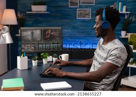 Filmmaker man editing movie footage on computer working at multimedia project using post production software in creativity studio. Videographer creating visual effects for agengy content. Remote work