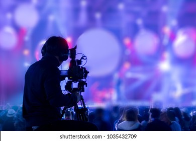 The filmmaker is recording and broadcasting live concerts on camcorders. Professional Video Recording Business - Shutterstock ID 1035432709