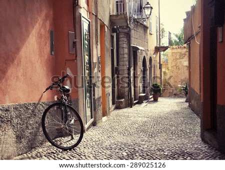 Filtered image of a bicycle on the narrow street of Bellagio town at the famous Italian lake Como