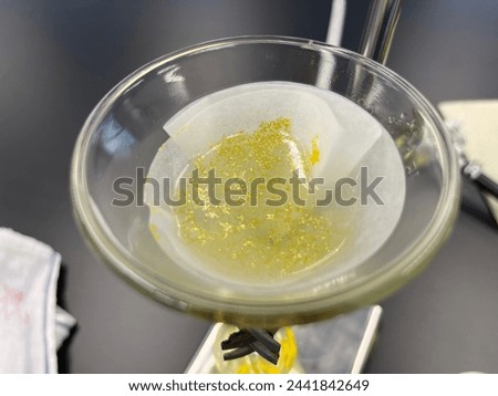 Filtering Golden solid Lead (II) iodide was produced from the reaction of Lead (II Nitrate and Potassium Iodide