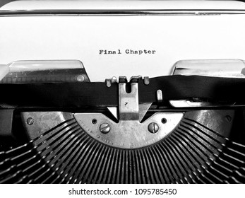 Final Chapter, manuscript heading or title typed in black ink on white paper on old vintage manual typewriter machine