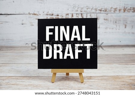 Final Draft text with easel on wooden background