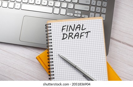 FINAL DRAFT text written on notebook on the laptop