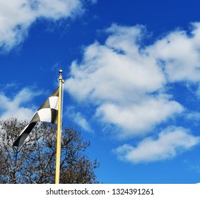 Final Lap Flag And Clouds