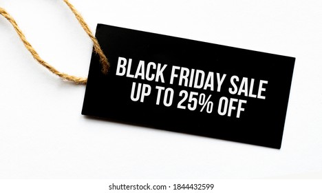 FINAL SALE UP TO 25 percents text on a black tag on a white paper background