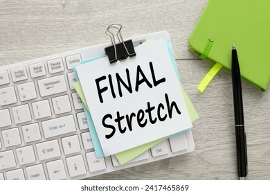 Final Stretch text on note paper on white keyboard