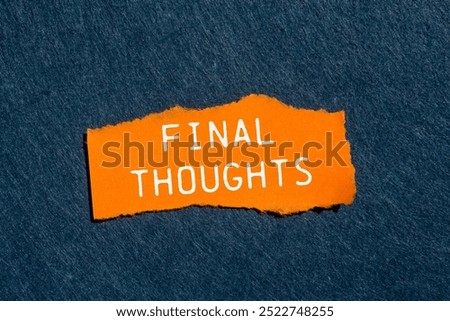 Final thoughts message written on ripped torn orange paper piece with gray felt background. Conceptual final thoughts symbol. Copy space.