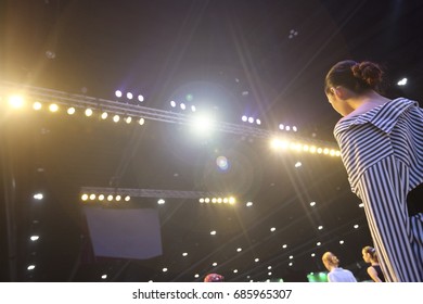 Finale Session From Professional Woman Models On Ramp Stage With Full Scale Lighting On Ceiling, Shoot From Behind No Face, Low Exposure