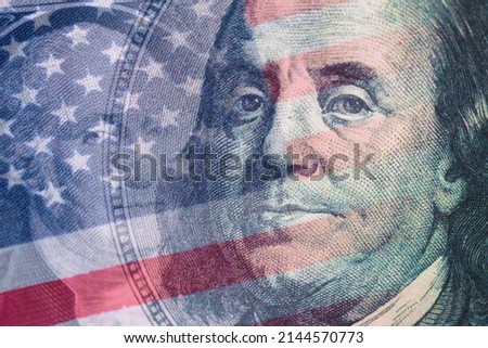 Finance background. Combined image of Benjamin Franklin, United States of America flag and George Washington portraits on the US 100 and 1 dollar bill. Macro shot.