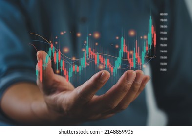 Finance and business investment concept. Stock and crypto investment funds.Businessman analyzing or trading Forex graphs of financial data candlestick chart.