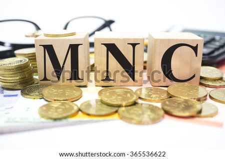 Finance Concept with Stack of Coins, MNC or Multinational Corporation written