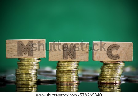 Finance Concept with Stack of Coins - MNC (Multinational Corporation) written on.