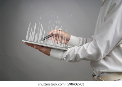 Finance data concept. Man working with Analytics. Chart graph information on digital screen.