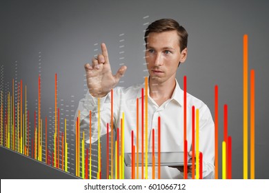 Finance data concept. Man working with Analytics. Chart graph information on digital screen.
