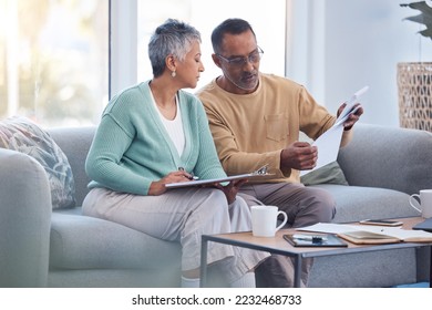 Finance, documents and senior couple on sofa with bills, paperwork and insurance checklist in home, life or asset management, Elderly black people on couch with financial, retirement or mortgage debt - Shutterstock ID 2232468733
