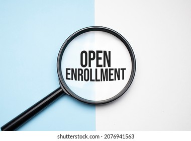 Finance and economics concept. Magnifier on a white background, inside the text is written - open enrollment - Shutterstock ID 2076941563