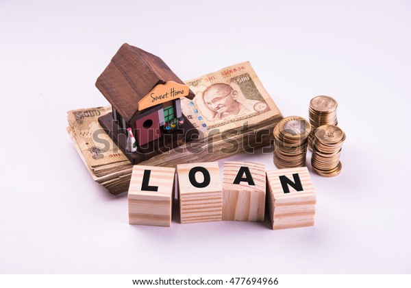 Finance\
and Housing Loan or purchase in India -  Concept showing 3D house\
model, indian currency notes and calculator\
etc