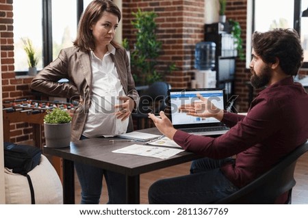 Finance office workers discuss ineffective startup project ideas, with paperwork and business documents supporting a workplace planning scene.