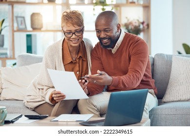 Finance, Paperwork And Happy Black Couple On Sofa Check Bank Account, Financial Statements And Report. Budget, Saving And Middle Aged Man And Woman Do Online Banking On Laptop With Documents At Home