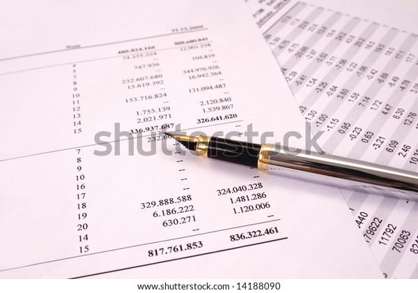 Finances and balances with
pen